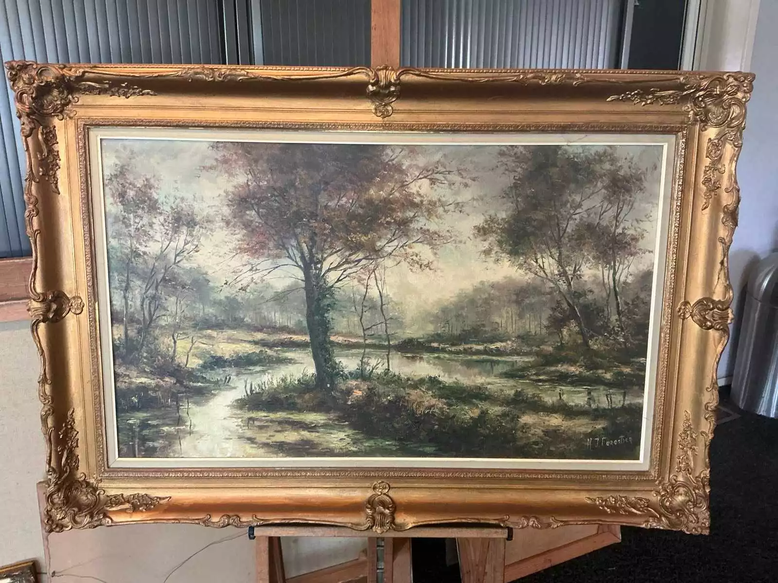 Olieverfschilderij ‘Boslandschap met waterpartij’ – H.J. Forestier, gesigneerd, met lijst (85 x 125 cm)