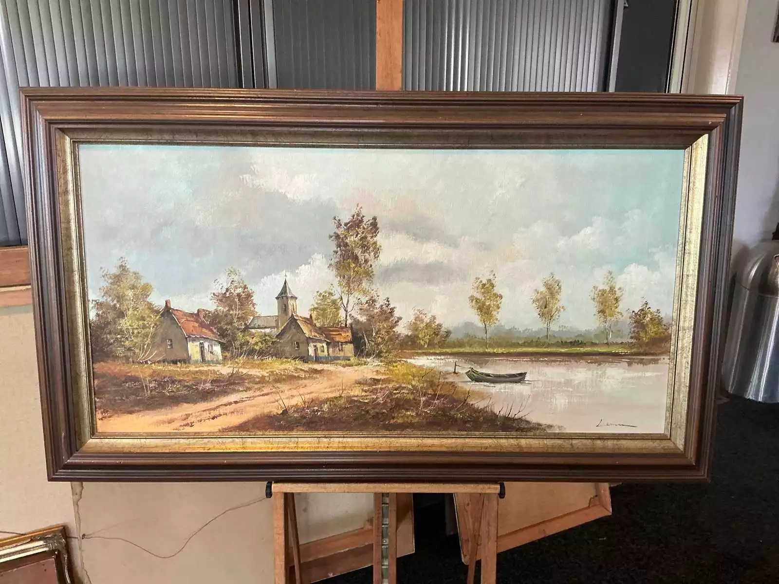 Olieverfschilderij ‘Rivierlandschap met boerderijen en roeiboot’ – Liemm (80 x 140 cm, incl. lijst)