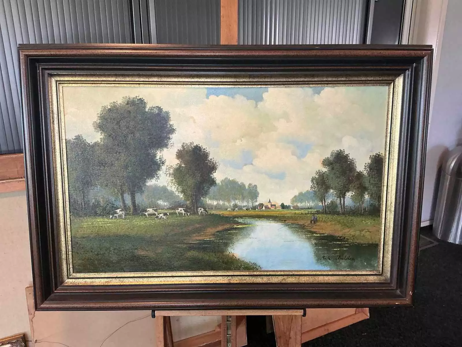 Rik Uulders – Olieverf ‘Dorpsgezicht met boerderijen’, incl. lijst (83×124 cm)